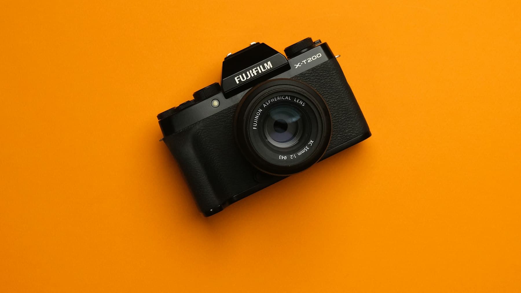 A camera on a plain background, representing estate agent photography day.