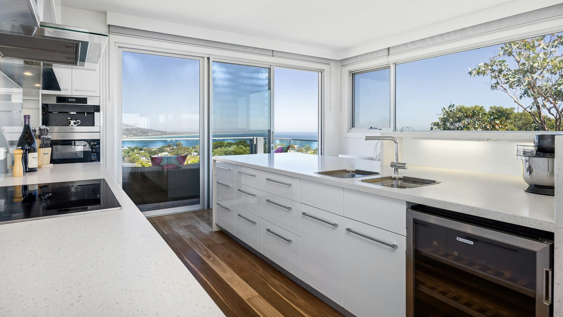 A clean bright kitchen with a sea view, suitable for a holiday-let or second-home listing.
